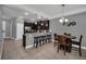 Modern kitchen with dark cabinets and breakfast bar at 8169 Roseville Rd, Davenport, FL 33896