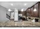 Modern kitchen with stainless steel appliances and granite counters at 8169 Roseville Rd, Davenport, FL 33896