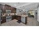 Modern kitchen with stainless steel appliances and granite counters at 8169 Roseville Rd, Davenport, FL 33896