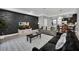 Living room with dark accent wall and open floor plan at 8169 Roseville Rd, Davenport, FL 33896