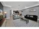 Open living room with view of kitchen and comfortable seating at 8169 Roseville Rd, Davenport, FL 33896
