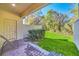 Private patio with grassy backyard and seating at 8169 Roseville Rd, Davenport, FL 33896