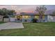 Attractive blue house with lights on at dusk at 1022 N Bumby Ave, Orlando, FL 32803