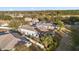 Two-story house with solar panels and a screened-in pool, aerial view at 117 Blue Heron Ct, Davenport, FL 33837