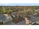Two-story house, screened pool, and a tree-lined street, aerial view at 117 Blue Heron Ct, Davenport, FL 33837