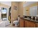 Bathroom with granite vanity and shower at 117 Blue Heron Ct, Davenport, FL 33837