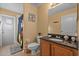 Bathroom with granite vanity and pool view at 117 Blue Heron Ct, Davenport, FL 33837