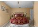 Guest bedroom with a queen bed and calm decor at 117 Blue Heron Ct, Davenport, FL 33837