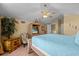 Bright bedroom with a comfortable bed and calming decor at 117 Blue Heron Ct, Davenport, FL 33837