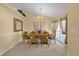 Formal dining room featuring a large table and chandelier at 117 Blue Heron Ct, Davenport, FL 33837