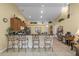 Kitchen with breakfast bar and view into living area at 117 Blue Heron Ct, Davenport, FL 33837