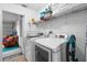 Laundry room with washer, dryer, shelving at 117 Blue Heron Ct, Davenport, FL 33837