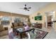 Living room with large windows, TV and access to bedroom at 117 Blue Heron Ct, Davenport, FL 33837