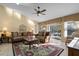 Sunlit living room with comfortable seating and access to patio at 117 Blue Heron Ct, Davenport, FL 33837