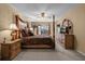 Spacious main bedroom with a large bed, plenty of light and ensuite bathroom at 117 Blue Heron Ct, Davenport, FL 33837