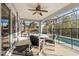 Enjoy this relaxing screened lanai, complete with outdoor seating and adjacent pool access at 117 Blue Heron Ct, Davenport, FL 33837