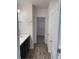 Modern bathroom with double vanity, tile floor, and walk-in shower at 247 Villavista Ct, Davenport, FL 33896