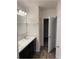Bright bathroom featuring a double vanity and tile flooring at 247 Villavista Ct, Davenport, FL 33896