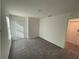Spacious bedroom with grey carpet and an ensuite bathroom at 247 Villavista Ct, Davenport, FL 33896