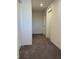 Long hallway with carpeted flooring and access to bedrooms at 247 Villavista Ct, Davenport, FL 33896