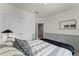 Comfortable bedroom with a queen-size bed, neutral decor, and double doors to hallway at 3313 Private Oak Dr, Apopka, FL 32703