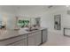 Island kitchen with granite countertop and stainless steel appliances at 3313 Private Oak Dr, Apopka, FL 32703