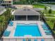 Community pool with cabana and plenty of lounge chairs at 3313 Private Oak Dr, Apopka, FL 32703