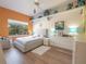 Light and airy bedroom with light-grey bed and wood floors at 336 E Kaley St, Orlando, FL 32806