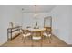 Bright dining room with a round table and four chairs at 4473 Davos Dr, Clermont, FL 34711