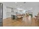 Modern kitchen with white cabinets, island, and hardwood floors at 4473 Davos Dr, Clermont, FL 34711