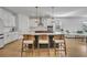 Modern kitchen with a large island, quartz countertops, and stainless steel appliances at 4473 Davos Dr, Clermont, FL 34711