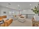 Bright and airy loft with sectional sofa and large windows at 4473 Davos Dr, Clermont, FL 34711