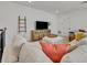 Comfortable loft with sectional sofa and media console at 4473 Davos Dr, Clermont, FL 34711