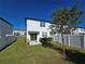 Private backyard with patio, small lawn and privacy fence at 604 Madison Dr, Davenport, FL 33837