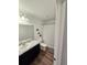 Bathroom with a shower/tub combo and grey striped curtain at 604 Madison Dr, Davenport, FL 33837