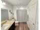Well-appointed bathroom with dark vanity and marble-look countertop at 604 Madison Dr, Davenport, FL 33837