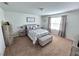 Spacious bedroom with carpeted floors and ample natural light at 604 Madison Dr, Davenport, FL 33837