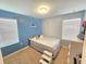 Charming bedroom with a full-size bed and blue walls at 604 Madison Dr, Davenport, FL 33837