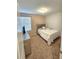 Simple bedroom with a full-size bed and neutral decor at 604 Madison Dr, Davenport, FL 33837