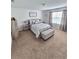 Relaxing bedroom featuring a queen bed and neutral decor at 604 Madison Dr, Davenport, FL 33837