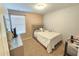 Comfortable bedroom with full bed and neutral decor at 604 Madison Dr, Davenport, FL 33837