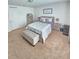 Cozy bedroom with queen bed, dresser and window at 604 Madison Dr, Davenport, FL 33837