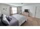 Bright bedroom with a king-size bed and large window at 604 Madison Dr, Davenport, FL 33837