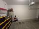 Attached garage with storage shelving and extra space at 604 Madison Dr, Davenport, FL 33837