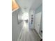 Bright hallway with light grey wood-look floors at 604 Madison Dr, Davenport, FL 33837