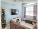 Relaxing living room with grey sofas and a flat-screen TV at 604 Madison Dr, Davenport, FL 33837