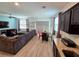 Spacious living room with sectional sofa and adjacent kitchen at 604 Madison Dr, Davenport, FL 33837