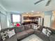 Open living space with sectional sofa and adjacent kitchen at 604 Madison Dr, Davenport, FL 33837