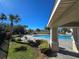 Community pool with lounge chairs and covered seating area at 604 Madison Dr, Davenport, FL 33837