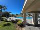 Community pool with lounge chairs and covered seating area at 604 Madison Dr, Davenport, FL 33837